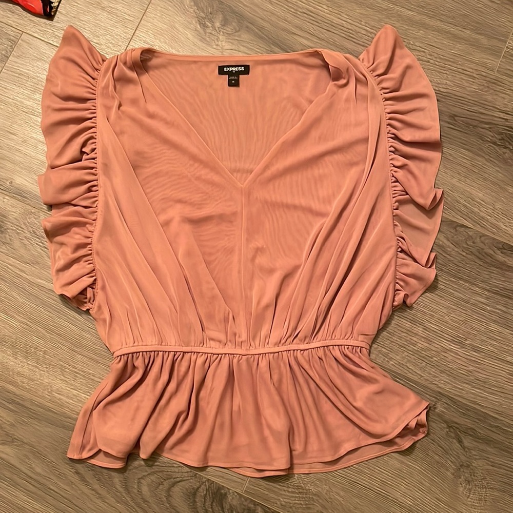 Express size XS nude partially sheer ruffle blouse.